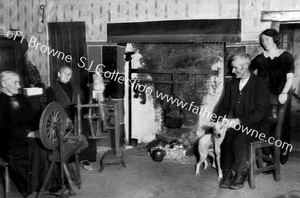 IN A COTTAGE HOUSE NEAR DRUMSHANBO WHERE THERE WAS HOME SPINNING  FR.CONEFREY & FR. GARAHY